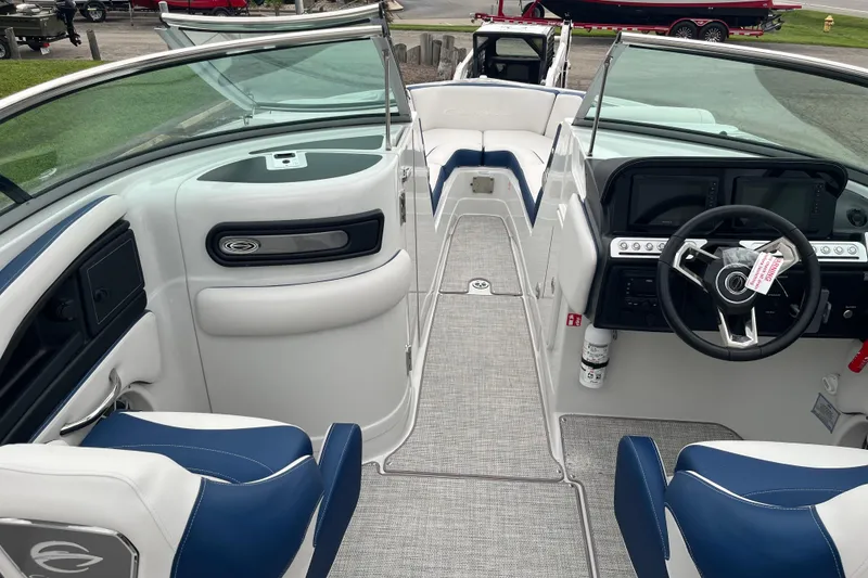 Slide: The Image of 2026 Crownline 270 SS boat interior with modern dashboard and seating. - 11