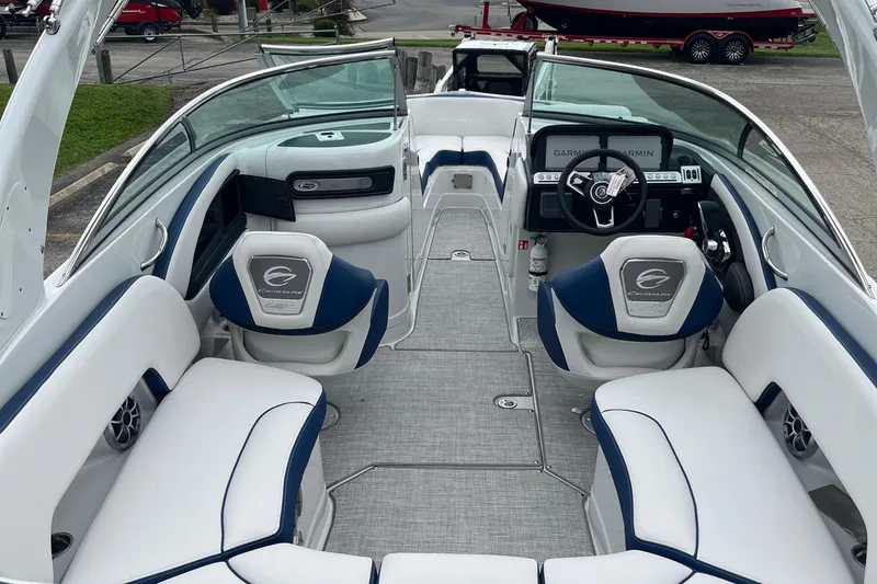 Slide: The Image of 2026 Crownline 270 SS boat interior with white and blue seating, modern dashboard. - 13
