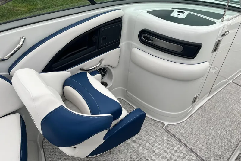 Slide: The Image of 2026 Crownline 270 SS boat interior with blue and white seating and modern design. - 18
