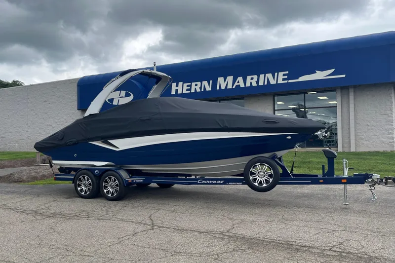 Slide: The Image of 2026 Crownline 270 SS boat on trailer outside Hern Marine dealership. - 2