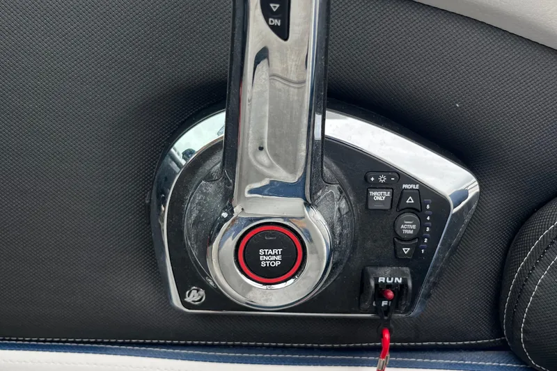 Slide: The Image of Control panel of 2026 Crownline 270 SS boat with start/stop button. - 24