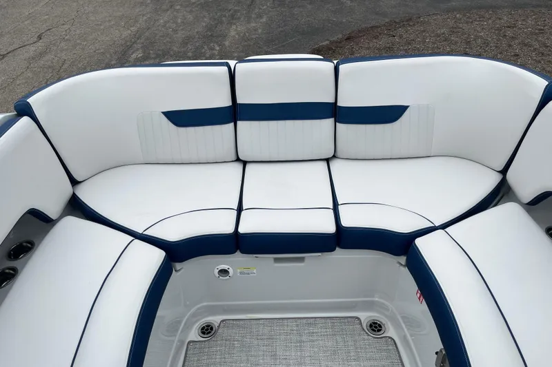 Slide: The Image of 2026 Crownline 270 SS boat interior with white and blue cushioned seating. - 5