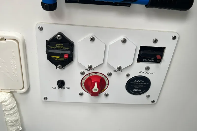 Slide: The Image of Control panel of a 2026 Crownline 270 SS boat with switches and circuit breakers. - 7