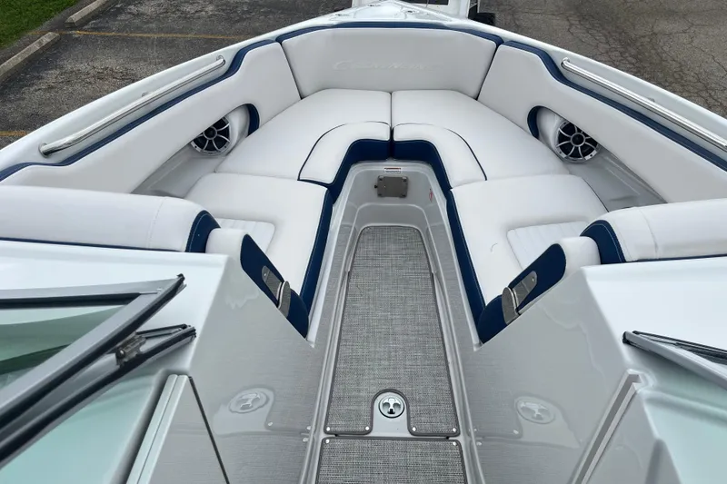 Slide: The Image of 2026 Crownline 270 SS boat interior with white seating and blue accents. - 9