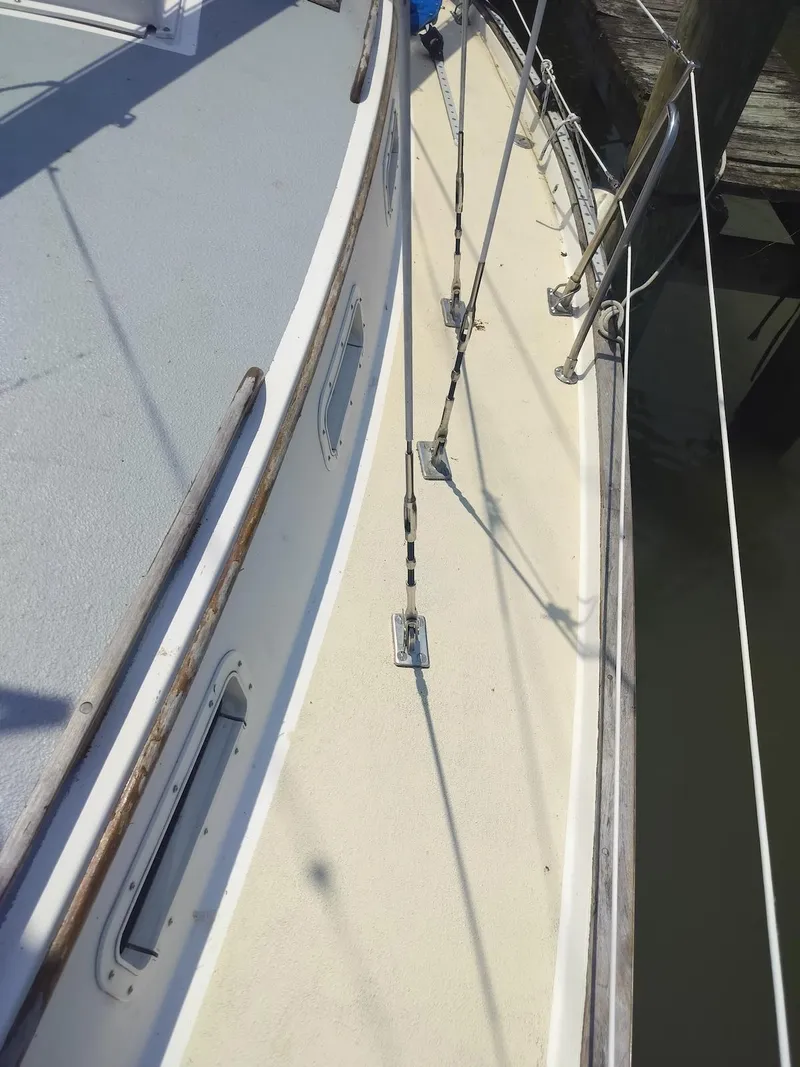 Slide: The Image of 1983 Morgan 32-3 sailboat deck with rigging and wooden trim. - 18