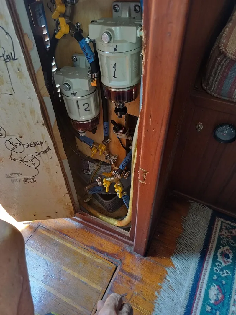 Slide: The Image of 1983 Morgan 32-3 boat interior showing fuel filters and plumbing system. - 20