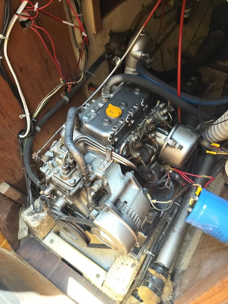 Slide: The Image of 1983 Morgan 32-3 engine compartment with visible wiring and components. - 24