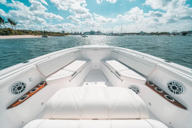 Slide: The Image of Luxurious 2022 Everglades 395cc boat interior with plush seating and ocean view. - 20