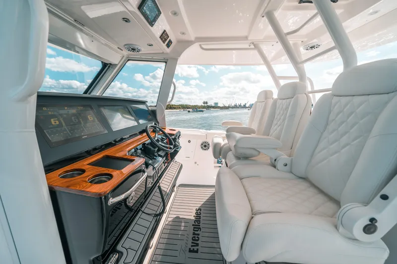 Slide: The Image of Luxurious interior of 2022 Everglades 395cc boat with plush seating and advanced controls. - 45