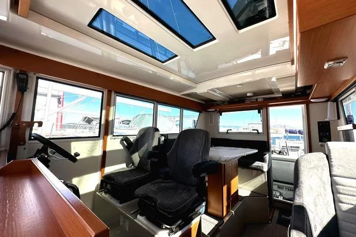 Slide: The Image of Interior of 2024 Sargo 36 boat with modern seating and large windows. - 10