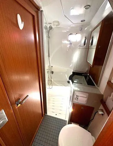 Slide: The Image of 2024 Sargo 36 yacht bathroom with shower, wooden cabinetry, and modern fixtures. - 11