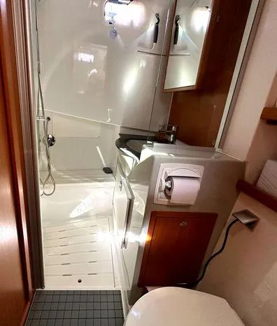 Slide: The Image of 2024 Sargo 36 boat bathroom with modern fixtures and wooden accents. - 12