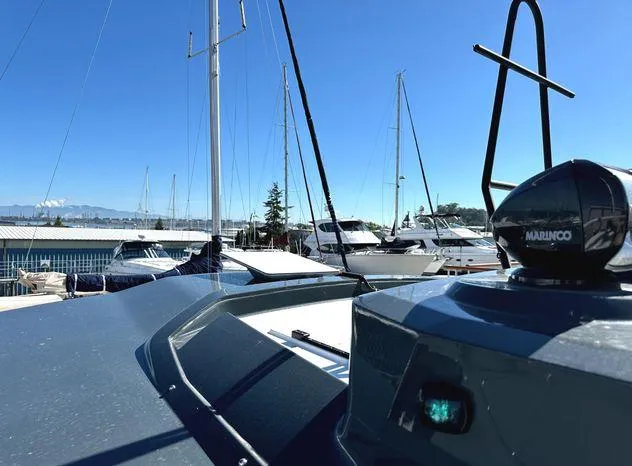 Slide: The Image of 2024 Sargo 36 boat docked at marina with clear blue sky. - 16
