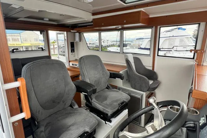 Slide: The Image of Interior of 2024 Sargo 36 boat with modern seating and steering wheel. - 19