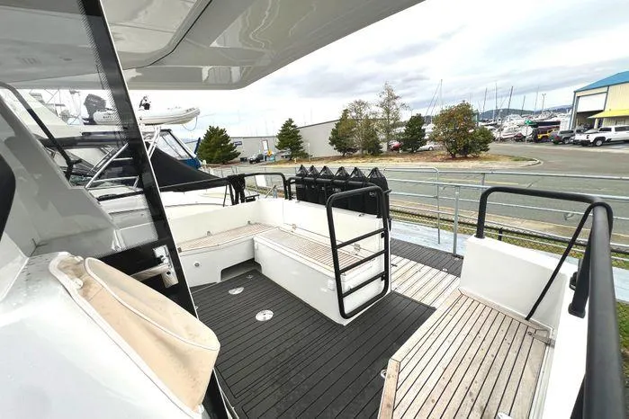 Slide: The Image of 2024 Sargo 36 boat deck with modern design, featuring spacious seating and sleek railings. - 23