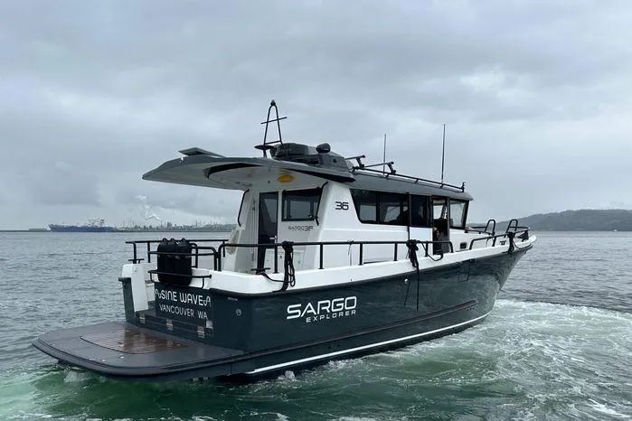 Slide: The Image of 2024 Sargo 36 boat navigating in cloudy waters, showcasing sleek design and modern features. - 3