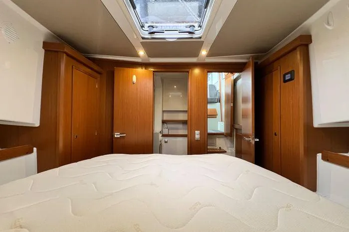 Slide: The Image of Interior of 2024 Sargo 36 boat cabin with wooden finish and skylight. - 34
