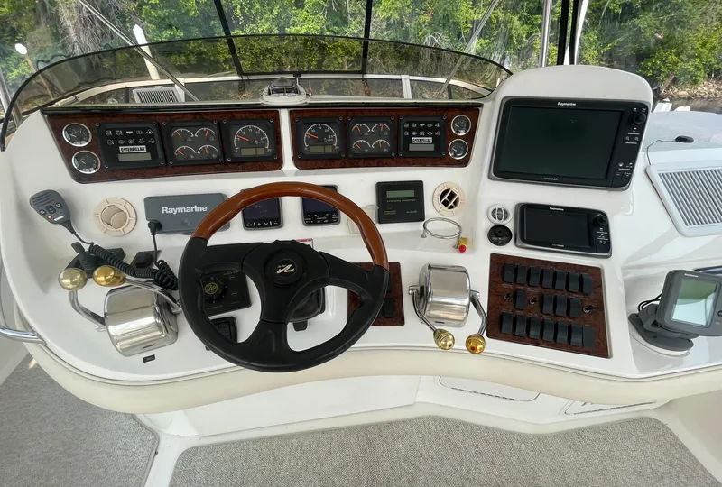 Slide: The Image of Control panel of a 2001 Sea Ray 480 Sedan Bridge yacht with navigation instruments. - 18