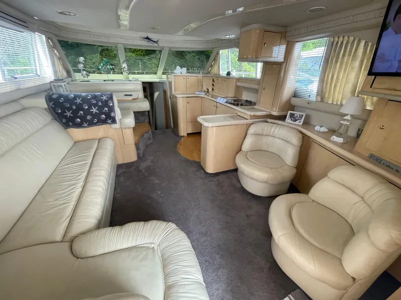 Slide: The Image of Luxurious interior of 2001 Sea Ray 480 Sedan Bridge yacht with plush seating and modern amenities. - 27