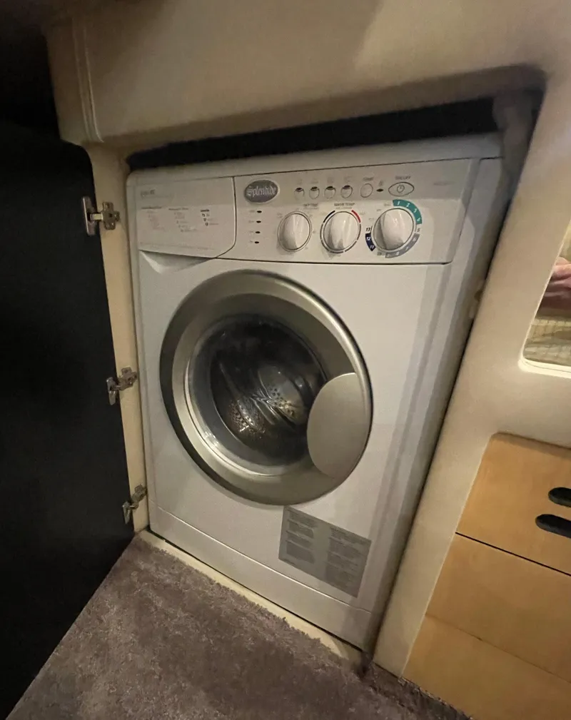 Slide: The Image of Washing machine inside 2001 Sea Ray 480 Sedan Bridge yacht interior. - 40