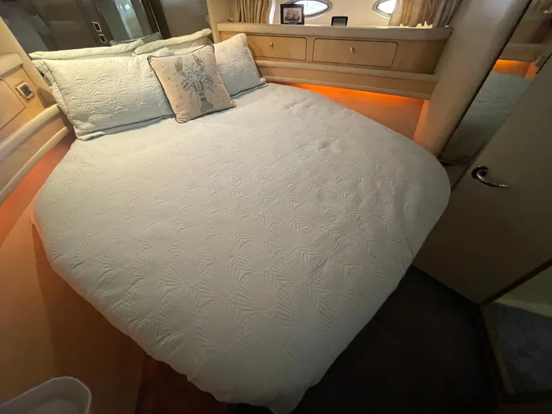 Slide: The Image of Luxurious bedroom interior of 2001 Sea Ray 480 Sedan Bridge yacht. - 46