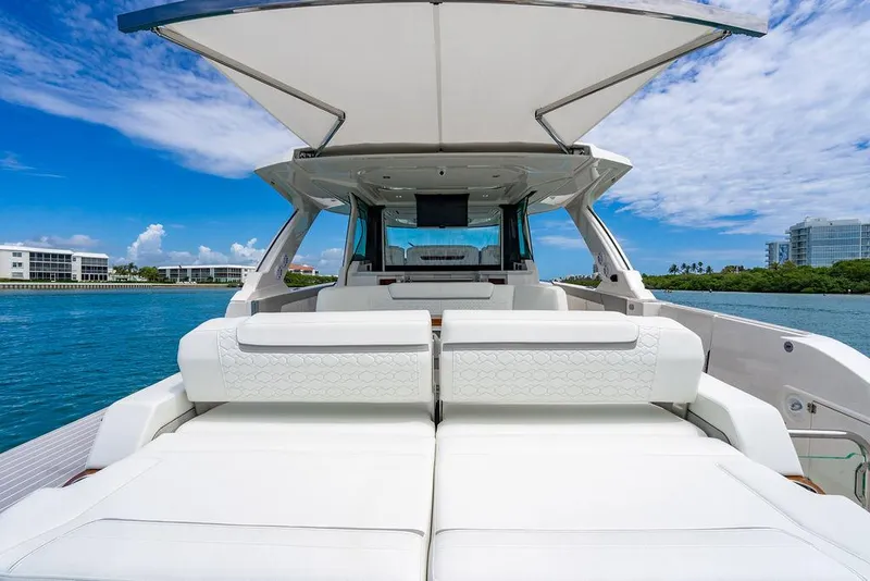 Slide: The Image of 2025 Tiara Yachts 48 LS luxury yacht with spacious deck and modern design on a sunny day. - 12