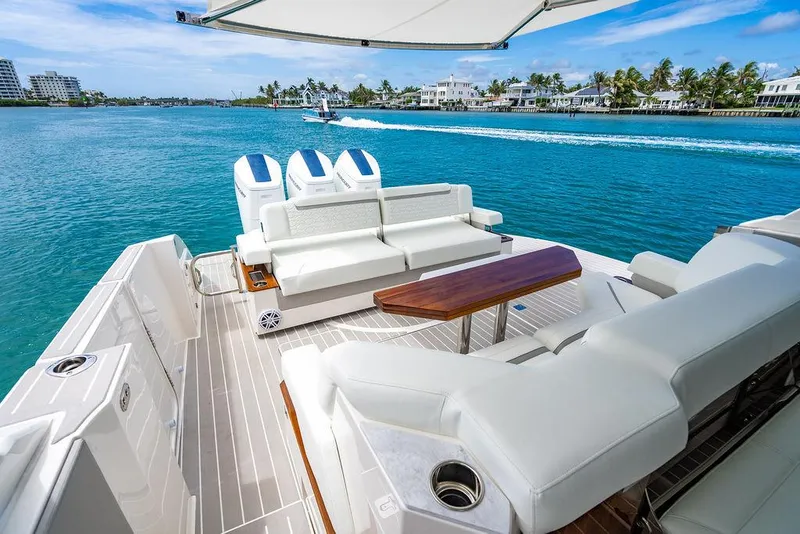 Slide: The Image of 2025 Tiara Yachts 48 LS luxury yacht interior with ocean view and modern seating. - 19