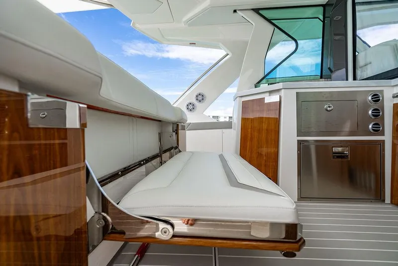 Slide: The Image of Luxurious interior of 2025 Tiara Yachts 48 LS with sleek seating and modern amenities. - 22