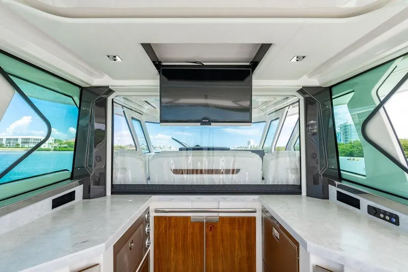 Slide: The Image of Interior of 2025 Tiara Yachts 48 LS with modern design and waterfront view. - 24