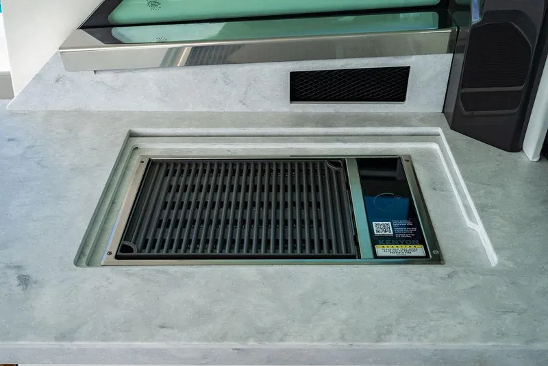 Slide: The Image of Built-in grill on 2025 Tiara Yachts 48 LS, featuring sleek countertop design. - 29