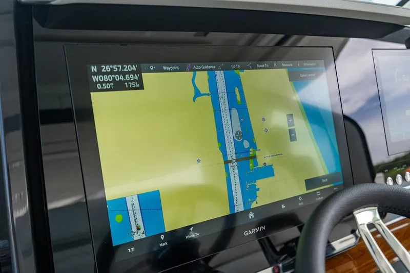 Slide: The Image of Garmin navigation display on 2025 Tiara Yachts 48 LS, showing nautical chart and coordinates. - 37