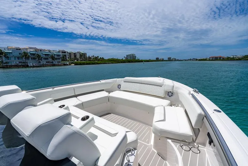 Slide: The Image of Luxurious 2025 Tiara Yachts 48 LS boat with spacious seating, cruising on a sunny day. - 43