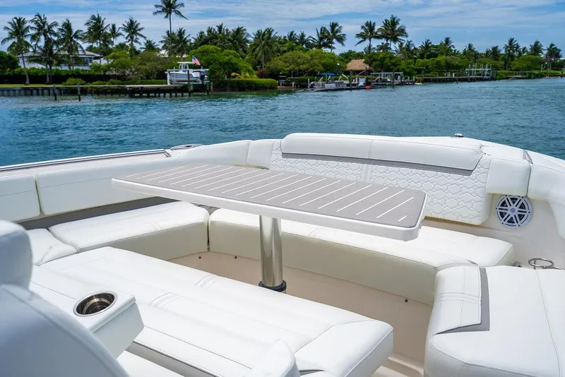 Slide: The Image of Luxurious seating area on 2025 Tiara Yachts 48 LS, with scenic waterfront view. - 45