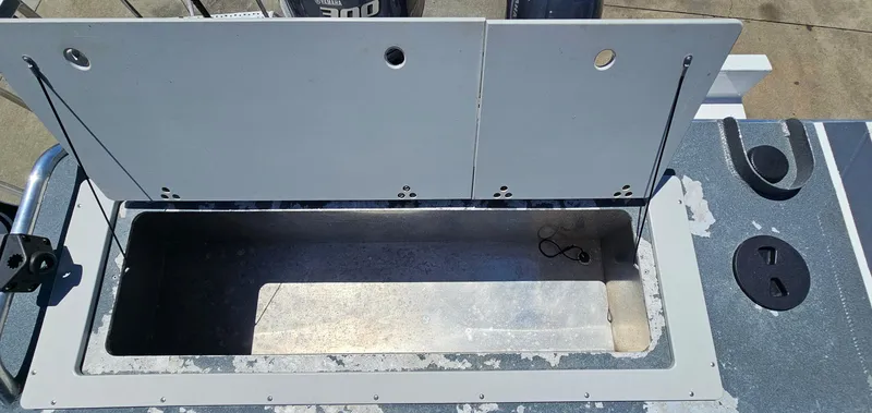 Slide: The Image of Open storage compartment on a 2015 Duckworth 26’ Offshore boat. - 18