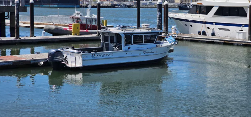 Slide: The Image of 2015 Duckworth 26’ Offshore boat docked in marina, calm water, clear day. - 4
