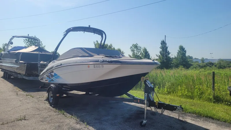 The Image of 2016 Yamaha Boats AR192 on trailer, parked outdoors on a sunny day. - 0