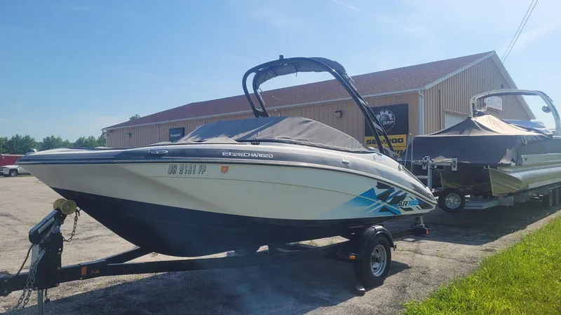Slide: The Image of 2016 Yamaha AR192 boat on trailer, parked outside a dealership on a sunny day. - 4