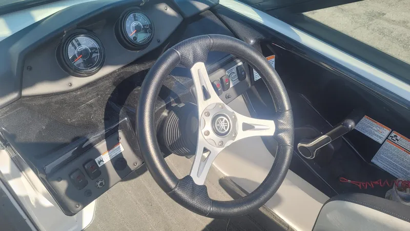Slide: The Image of 2016 Yamaha AR192 boat dashboard with steering wheel and control panel. - 8