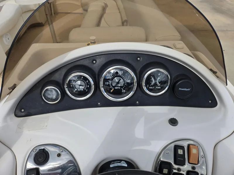 Slide: The Image of Dashboard of 2008 Starcraft Elite 226 RE CR boat with gauges and controls. - 10