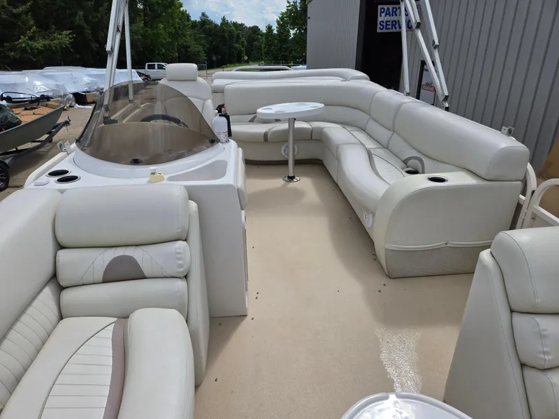 Slide: The Image of 2008 Starcraft Elite 226 RE CR pontoon boat with spacious seating and modern design. - 13