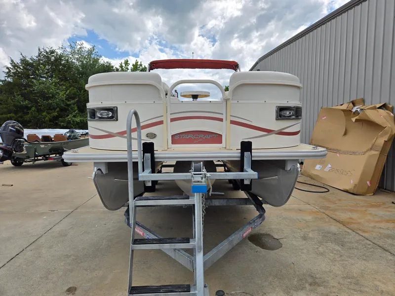 Slide: The Image of 2008 Starcraft Elite 226 RE CR pontoon boat on trailer, parked outdoors. - 20