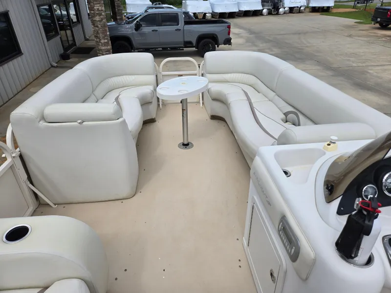 Slide: The Image of 2008 Starcraft Elite 226 RE CR pontoon boat with spacious seating and central table. - 7