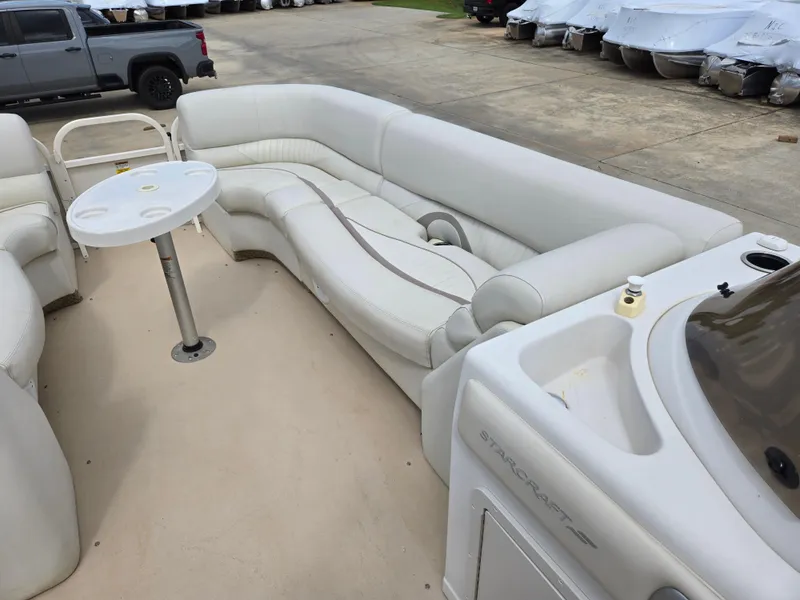 Slide: The Image of 2008 Starcraft Elite 226 RE CR pontoon boat with white seating and table. - 8