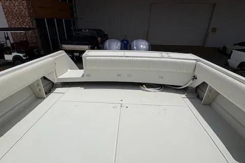 Slide: The Image of 1997 Stamas 310 Express boat deck with seating and storage compartments. - 13