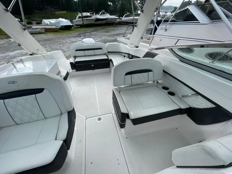 Slide: The Image of 2020 Regal 26 OBX boat interior with white seating and modern design. - 3