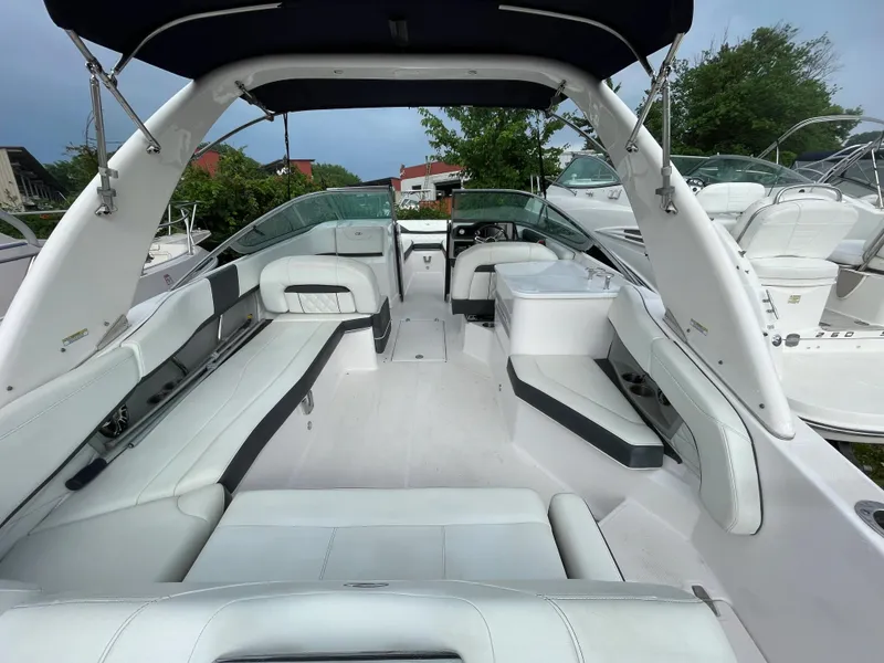 Slide: The Image of 2020 Regal 26 OBX boat interior with white seating and sleek design. - 4
