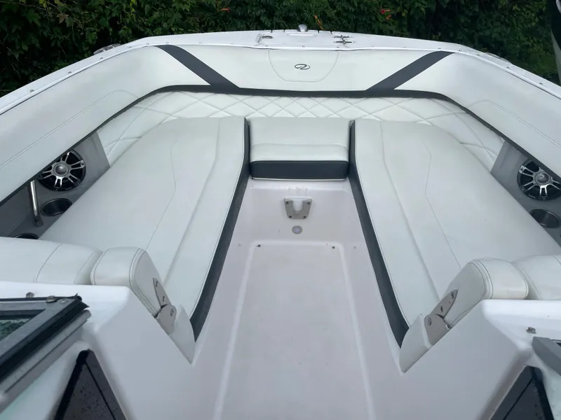Slide: The Image of Luxurious interior of 2020 Regal 26 OBX boat with white seating and speakers. - 6