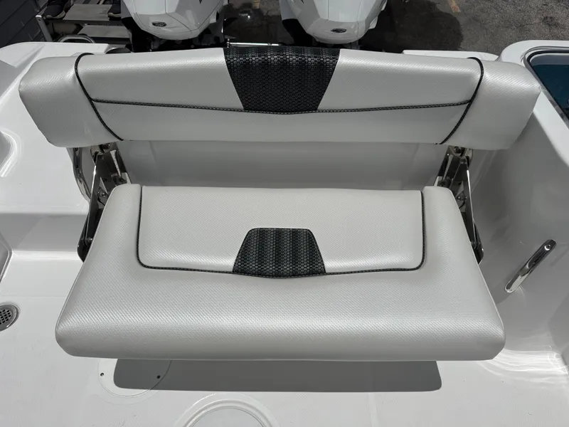 Slide: The Image of 2025 Wellcraft 242 Fisherman boat seat with sleek white and black design. - 11