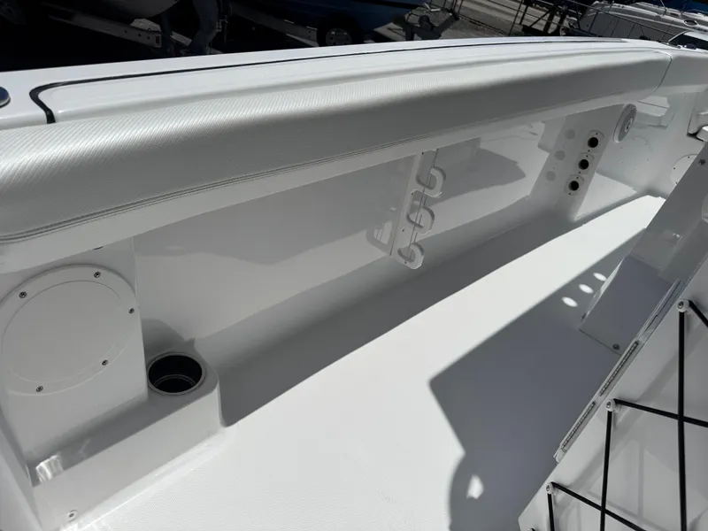 Slide: The Image of 2025 Wellcraft 242 Fisherman boat interior, featuring sleek white design and modern amenities. - 14