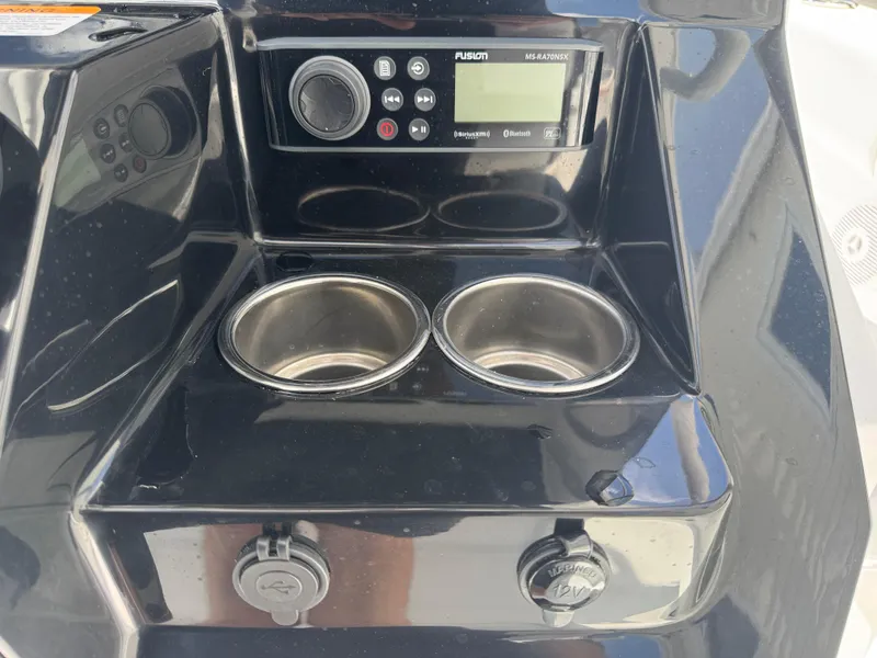 Slide: The Image of 2025 Wellcraft 242 Fisherman console with Fusion stereo and dual cup holders. - 16